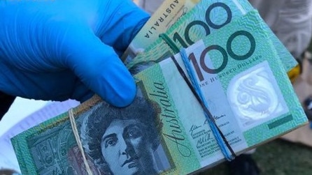 Strike Force Bunjil officers discovered almost $180,000 in cash. Picture: NSW Police.