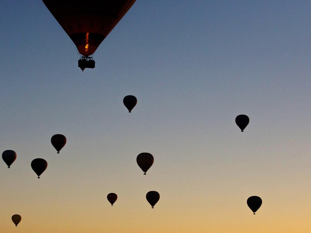 Tourists ride hot air balloons near the town of Goreme on April 17, 2016 in Nevsehir, Cappadocia, Turkey. Picture: Getty