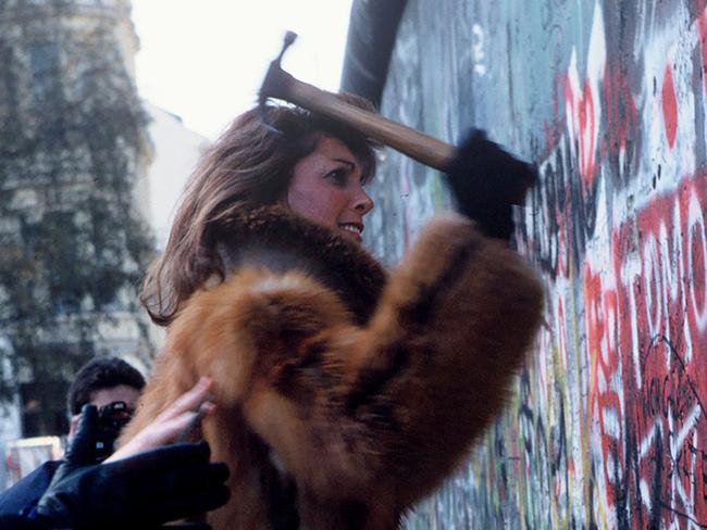 ‘Caught in this rushing moment’ ... Berliners tear down the wall in 1989.