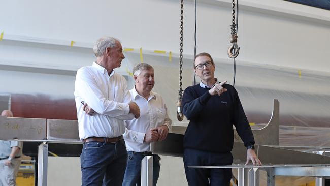 Toby Richardson, left, and Ron Devine from Richardson Devine Marine with Sealink chief executive Jeff Ellison. Picture: LUKE BOWDEN