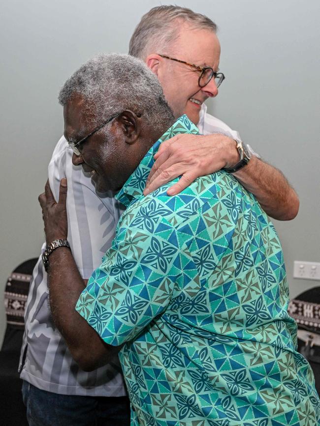 Mr Albanese hugs Solomon Islands Prime Minister Manasseh Sogavare.