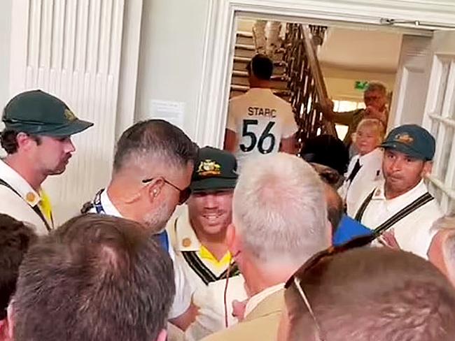 Usman Khawaja and Dave Warner in dispute with several MCC Members in the Long Room at Lords during the lunch break.