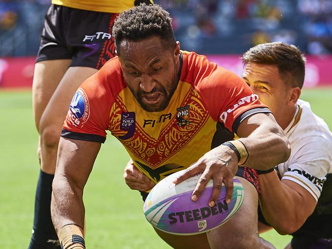 SYDNEY, AUSTRALIA - OCTOBER 19: Justin Olam of Papua New Guinea scores a try during the round 2 Rugby League World Cup 9s match between New Zealand and Papua New Guinea at Bankwest Stadium on October 19, 2019 in Sydney, Australia. (Photo by Brett Hemmings/Getty Images)