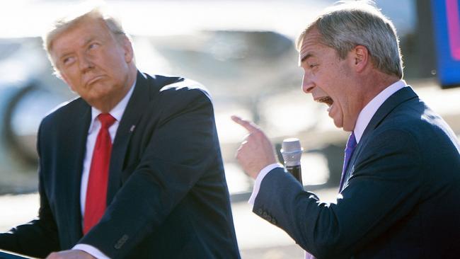 US President Donald Trump listens as Nigel Farage speaks during a rally in 2020. (Photo by Brendan Smialowski / AFP)