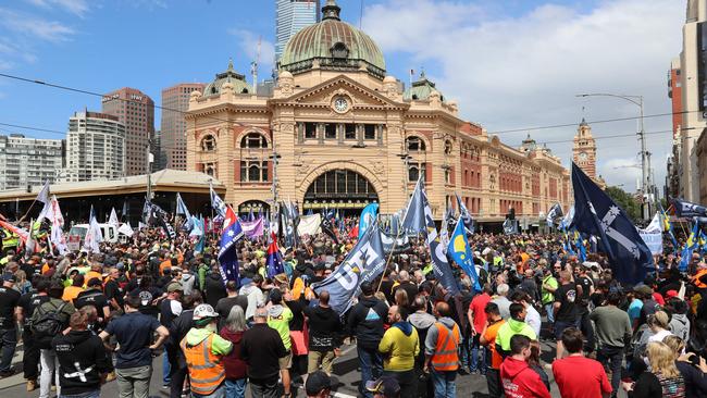 Melbourne’s busy Flinders St Station intersection comes to a standstill. Picture: Alex Coppel