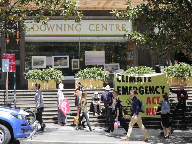 Extinction Rebellion protesters outside the Downing Centre in Sydney on Monday. Picture: NCA NewsWire / Christian Gilles