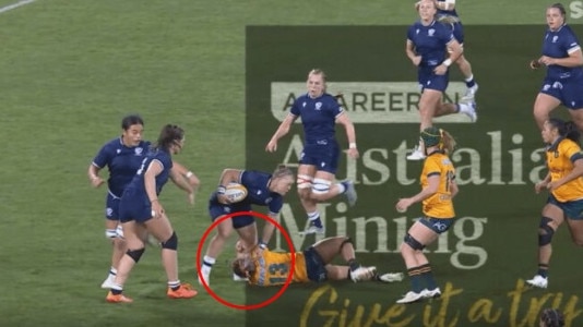 USA's Alev Kelter stomps on Australia's Georgie Friedrichs.