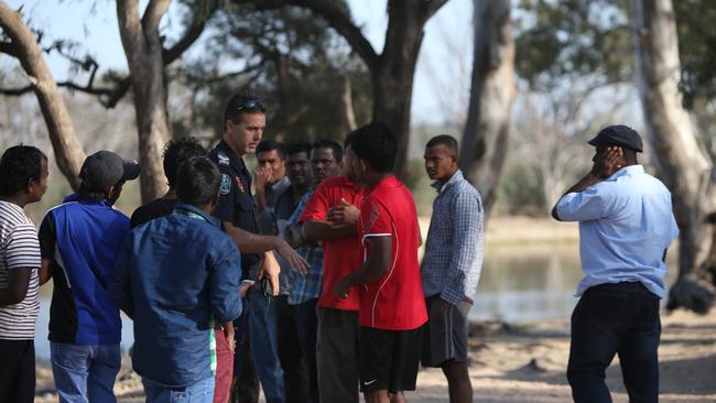 Police deliver the grim news to shocked friends. Picture: Simon Cross