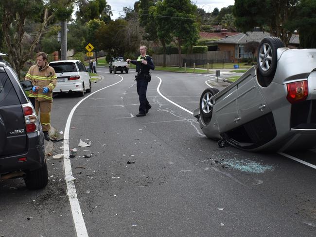 A car flipped in Croydon Hills Drive this afternoon. Picture: Victoria Police.