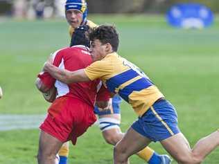 SOLID DEFENCE: Toowoomba Grammar School player Jacob Burgoyne wraps up his Ipswich opponent during their match last weekend. Picture: Kevin Farmer