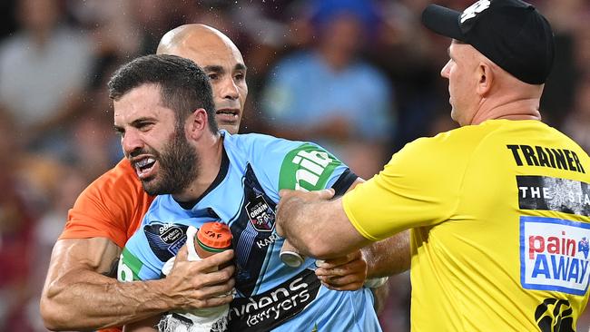 James Tedesco staggers to his feet after suffering a head knock in Origin III