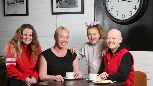 Jenny Barbary from Quartz Cafe and Kristy Lucadei with her daughters Imogen (left) and Tahlia.Picture: AAP/Emma Brasier