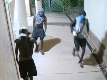 Terrifying CCTV vision captured the prolonged attempts of a gang of about seven youths trying to break into the Katherine Country Club while two workers were trapped inside. Picture: Supplied