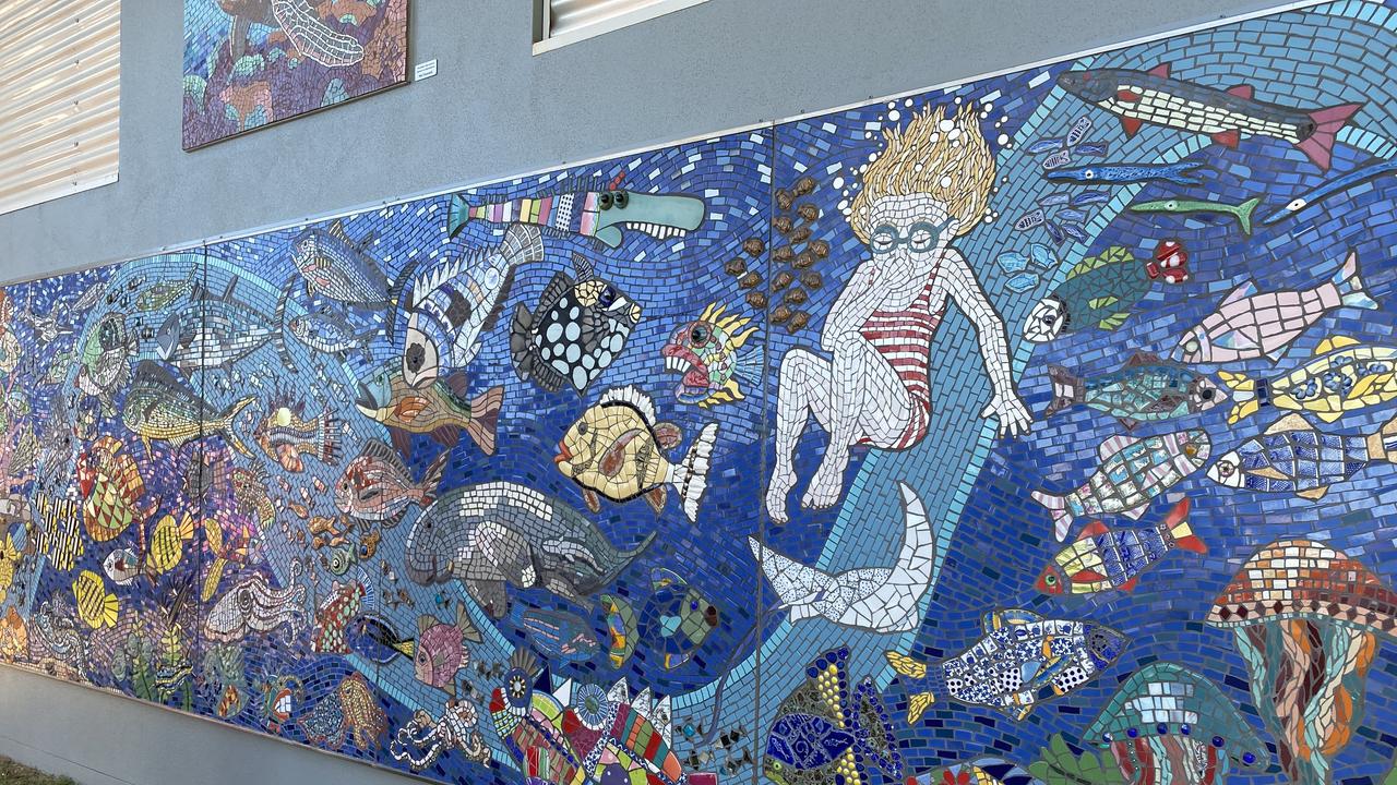 Two years in the making, 230 contributors from around the country, 100,000 pieces of tessera and an army of volunteers is what it took to bring Paul Perry's vision for the new artwork surrounding the public toilets at Archie's Beach.