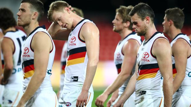 Adelaide players leave Metricon Stadium after Sunday’s loss to Gold Coast. Picture: Getty Images