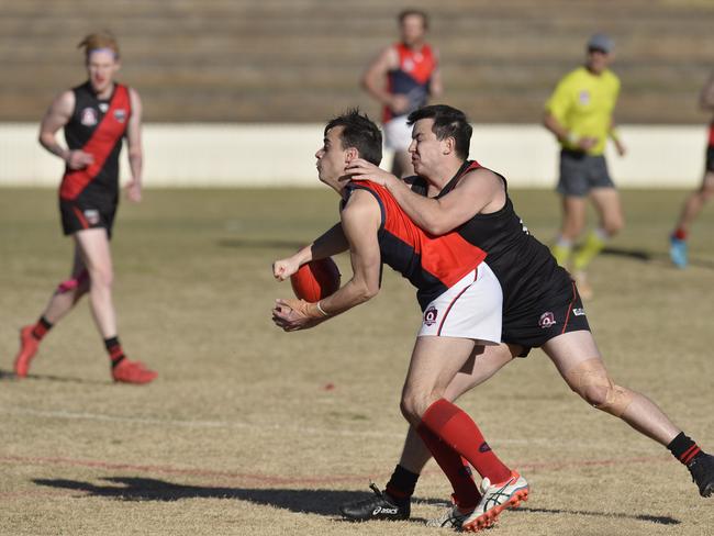 Warwick Redbacks player Mason Stewart (left) and Dylan Newman of South Toowoomba Bombers in AFL Darling Downs round 16 at Heritage Oval, Saturday, August 18, 2018.