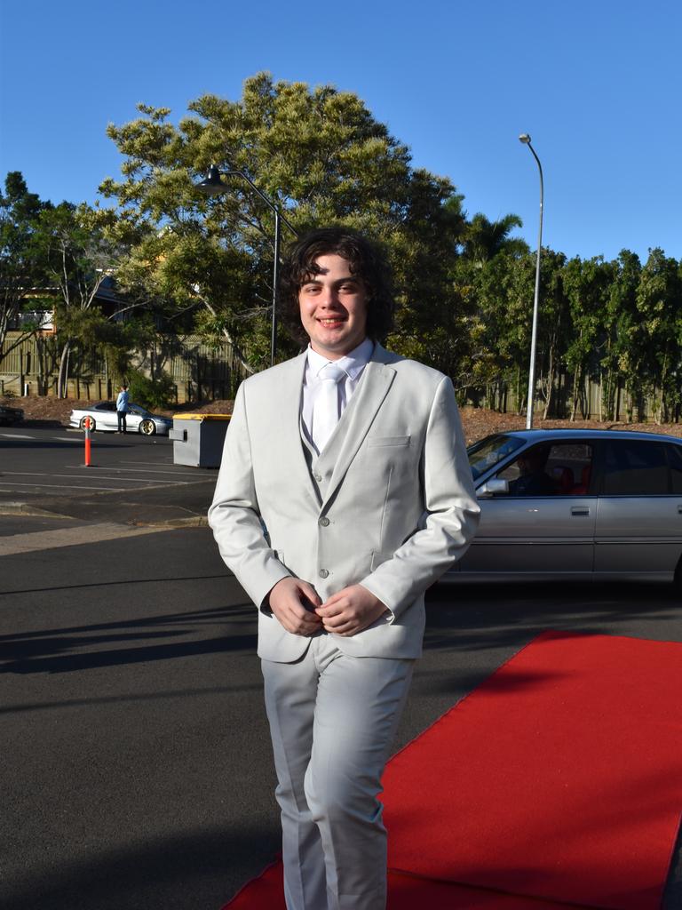 RIVERSIDE FORMAL: Ryan Grimshaw walks down the red carpet at the Riverside Christian College Formal. Photo: Stuart Fast