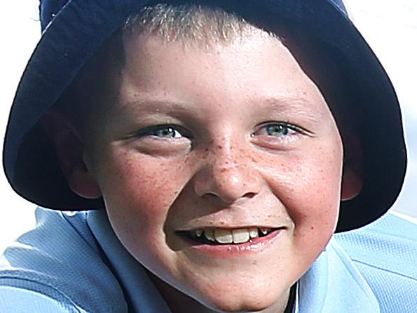 Moonah Primary students Bradley Measday 11, left, Darcy Dare 11 and Jayden Kearney 10 in the school veggie patch. Picture: SAM ROSEWARNE