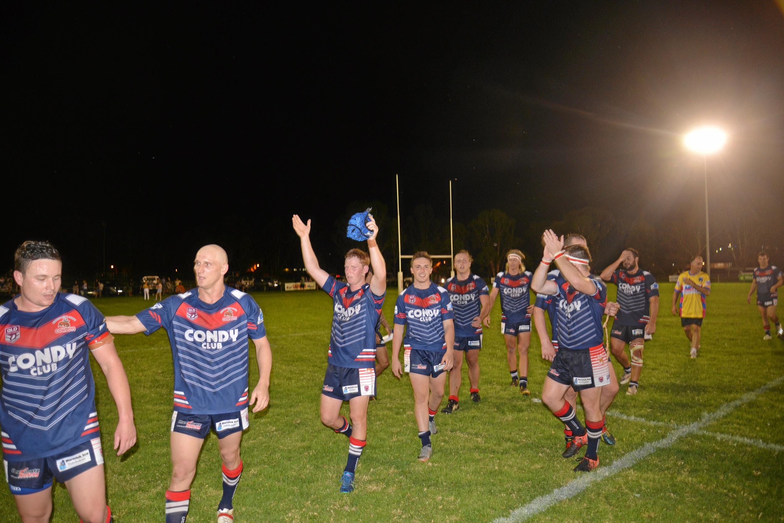 Warwick Cowboys (from left) Josh Cruice, Mick Bloomfield and Mitch McMahon and teammates after a 22-18 win against Wattles in the Basil Nolan Memorial Shield game. Picture: Gerard Walsh