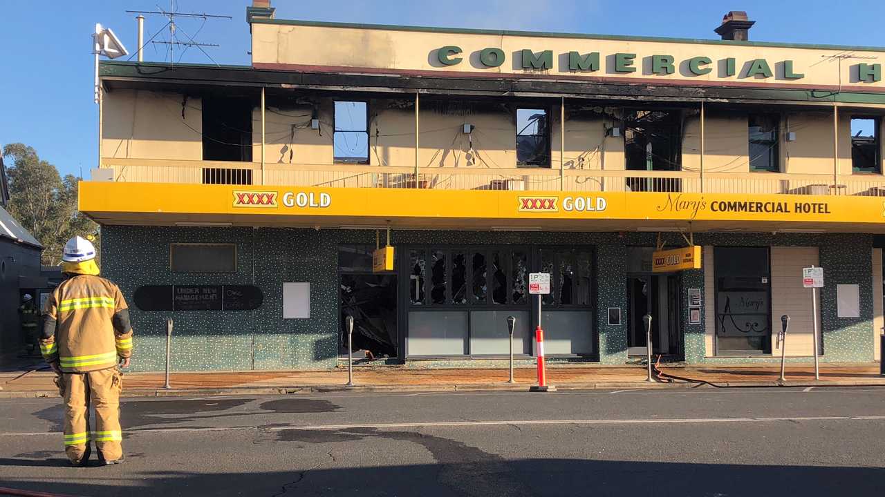 FIRE DAMAGE: Fire fighters assess the damage caused by a huge blaze at Dalby's Commercial Hotel. . Picture: Michael Doyle