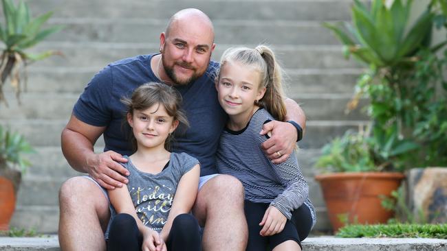 Brendan Penglaze with his daughters Meia and Chloe. Picture: Sue Graham