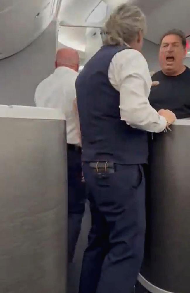 Another angry flyer was seen screaming in fury at the woman and flight attendant. Picture: Newsflash/NX