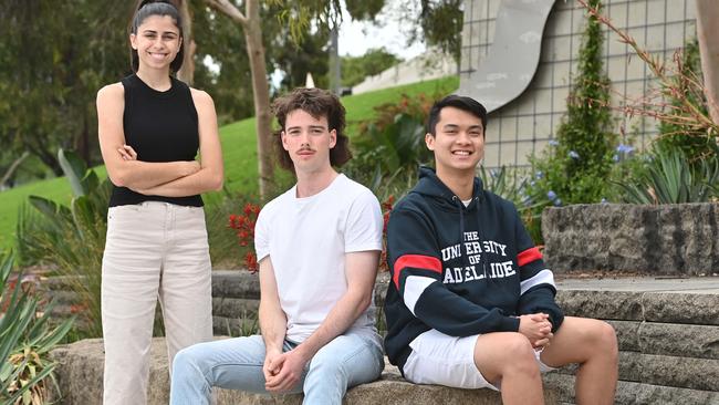 Like most young students, Courtney Bouzikos (Uni SA), Tom Shearing (Flinders Uni) and Alex Vu (The University of Adelaide) will have HECS debts to contend with. Picture: Keryn Stevens