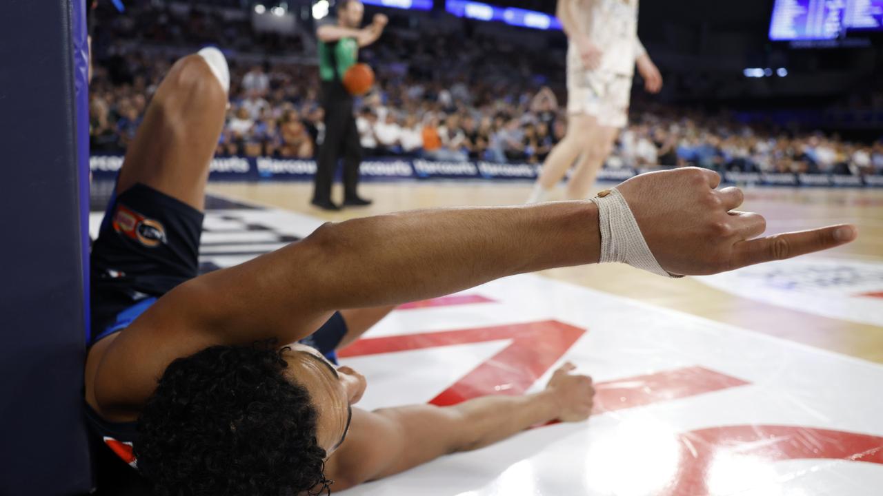 Melbourne United’s Flynn Cameron reacts after being fouled by Rob Edwards of the Taipans. Picture: Getty Images.