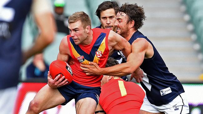 South Australia's Andrew Bradley takes on Victoria's Willie Wheeler. Picture: Tom Huntley