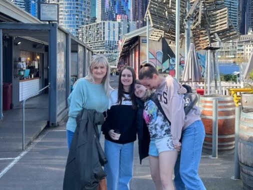 Karen Hedger, who tragically died in her sleep last month, with her three daughters Keischa Brown, Paris Hedger and Charlie Hedger. Picture: Supplied by family