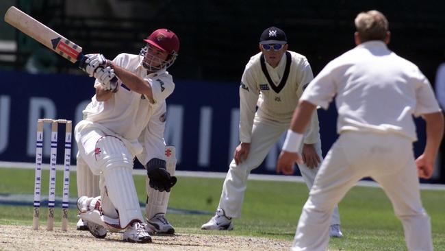 Jim Maher punishes a loose ball from Shane Warne.