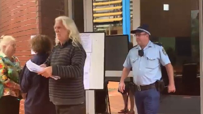 John Anderson being escorted from the Byron Shire Council chambers in Mullumbimby during the April 2021 ordinary meeting. Police were also called to a meeting in May when Mr Anderson initially refused to leave when asked, but ultimately left of his own accord before officers arrived. Picture: Liana Boss