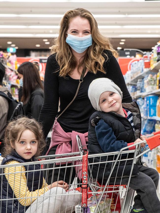 Majella Grawatsch, with children William and Audrey, is wearing a mask in public. Picture: Flavio Brancaleone