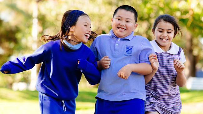 St Johns Park students Melina Shrestha, Jayden Khamsisavatdy and Sadan Bayati. Picture: Jonathan Ng