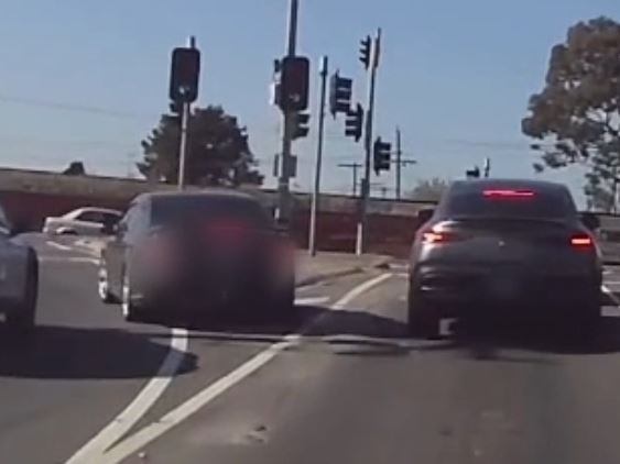 A grey Ford Falcon with false number plates pulls up beside the victim’s dark Mercedes wagon. Picture: Victoria Police