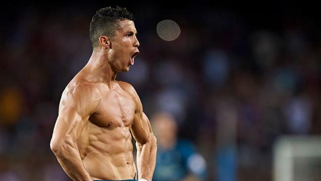 Cristiano Ronaldo flexes after scoring against Barcelona.