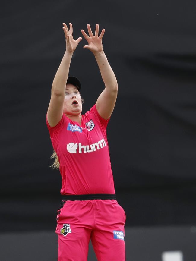 Sixers' Lauren Cheatle taking a catch in the WBBL in December.