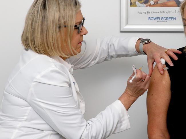 ADELAIDE, AUSTRALIA - NewsWire Photos JULY 19 2021: Chief Pharmacist Robyns Johns gives Sue Fishlock her 2nd dose of the AstraZeneca vaccine at the Littlehampton National Pharmacies in the Adelaide Hills. Picture: NCA NewsWire / Kelly Barnes