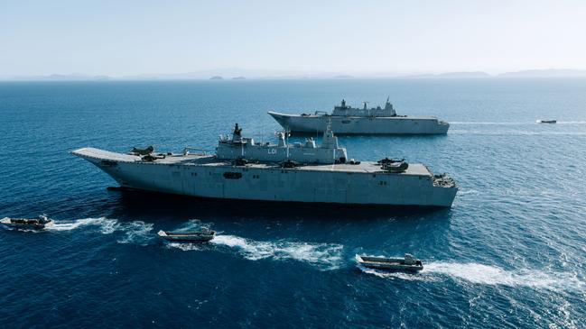 The amphibious assault (landing helicopter dock) ships HMAS Canberra and HMAS Adelaide in formation with landing craft during Exercise Sea Explorer 2019. Picture: ADF