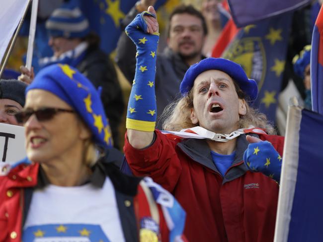 Anti Brexit campaigners demonstrate in Westminster in London, Monday, Nov. 19, 2018. The EU nations and Britain are still negotiating the outline text of a draft Brexit deal, setting out their future relationship which will have to be ratified by both the British and the European Parliaments. (AP Photo/Kirsty Wigglesworth)