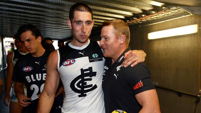 ADELAIDE, AUSTRALIA - APRIL 06: Jacob Weitering of the Blues and Michael Voss, Senior Coach of the Blues celebrate during the 2024 AFL Round 04 match between the Fremantle Dockers and the Carlton Blues at Adelaide Oval on April 06, 2024 in Adelaide, Australia. (Photo by Michael Willson/AFL Photos via Getty Images)