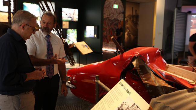 Prime Minister Anthony Albanese given a tour through the MAGNT Cyclone Tracy exhibition by Territory historian Jared Archibald on December 24, 2024. Picture: Sam Lowe