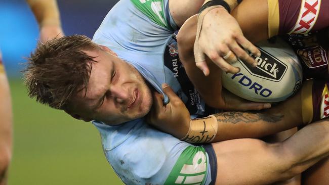 QLD's Anthony Milford is tackled by NSW's Angus Crichton during Game 1 of the NSW v QLD State of Origin series at the MCG. Picture: Brett Costello