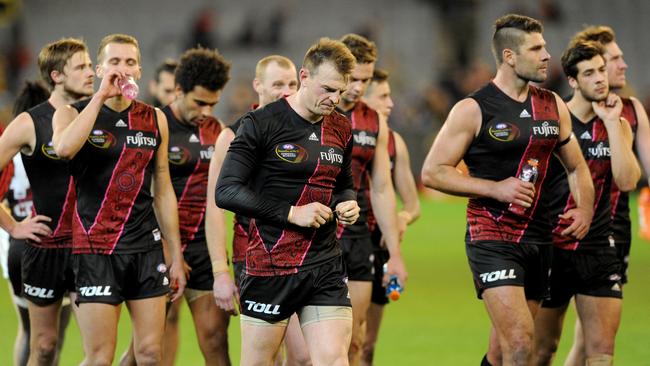 Essendon players after their loss to Richmond on Saturday night. Picture: AAP