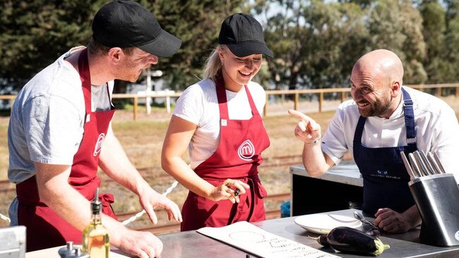 MasterChef contestants Tim Bone and Tess Boersma with judge George Calombaris during an episode filmed in Queenscliff in 2019.