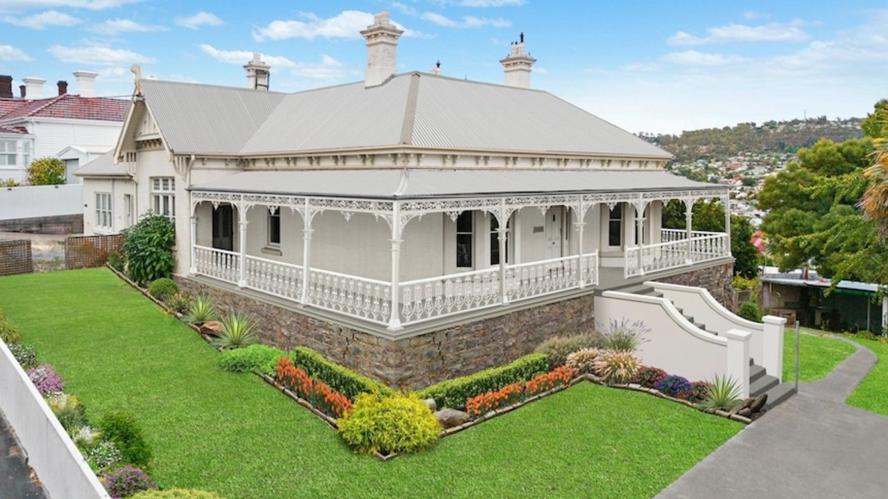 An “artist’s impression” image with its landscaping redone, rusty roof covered up, cracks repaired and even the lines of the brick facade smoothed out.