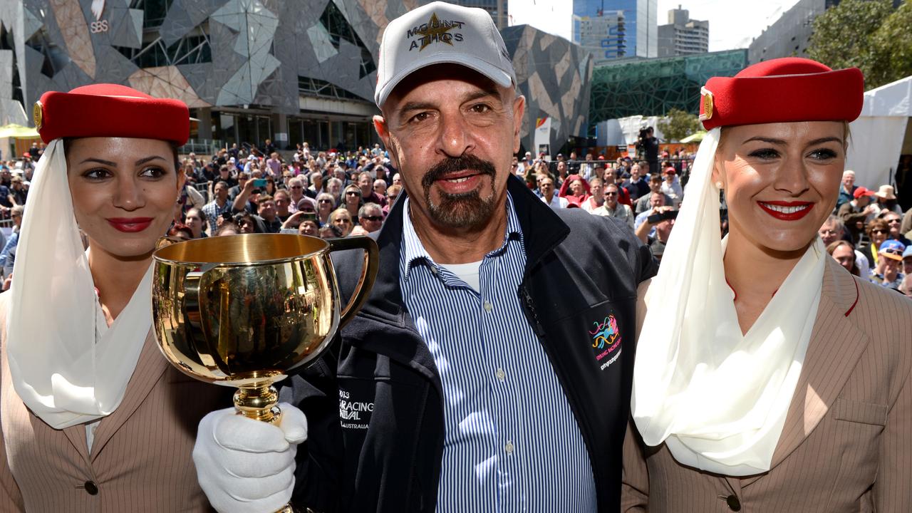 Melbourne Cup press conference featuring 2013 Emirates Melbourne Cup trainers and jockeys. A very confident Dr Marwan Koukash owner of Mount Athos holds the Cup after the Press conference.