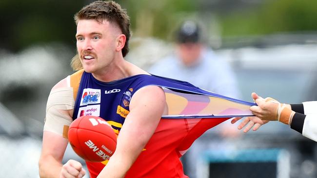 Mitchell Day of Diggers Rest is tackled by Owen Fowler of Wallan during the round two RDFNL Bendigo Bank Seniors match between Diggers Rest and Wallan at Diggers Rest Recreation Reserve, on April 13,2024, in Diggers Rest, Australia. (Photo by Josh Chadwick)