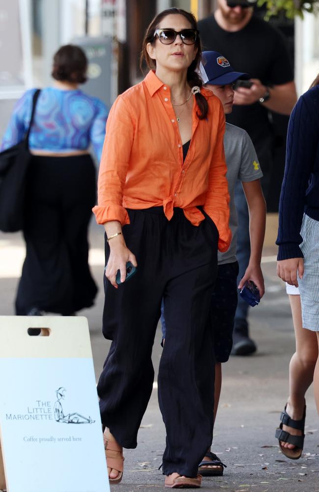 Looking every bit the Bondi local, Mary wore wide leg black pants and topped her outfit off with designer sunnies. Picture: Matrix Media Group.