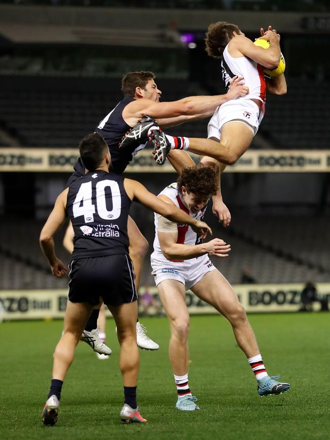 St Kilda’s Ben Long takes a spectacular mark over teammate Nick Coffield during the Saints’ win over Carlton at Marvel Stadium. Picture: AFL Photos